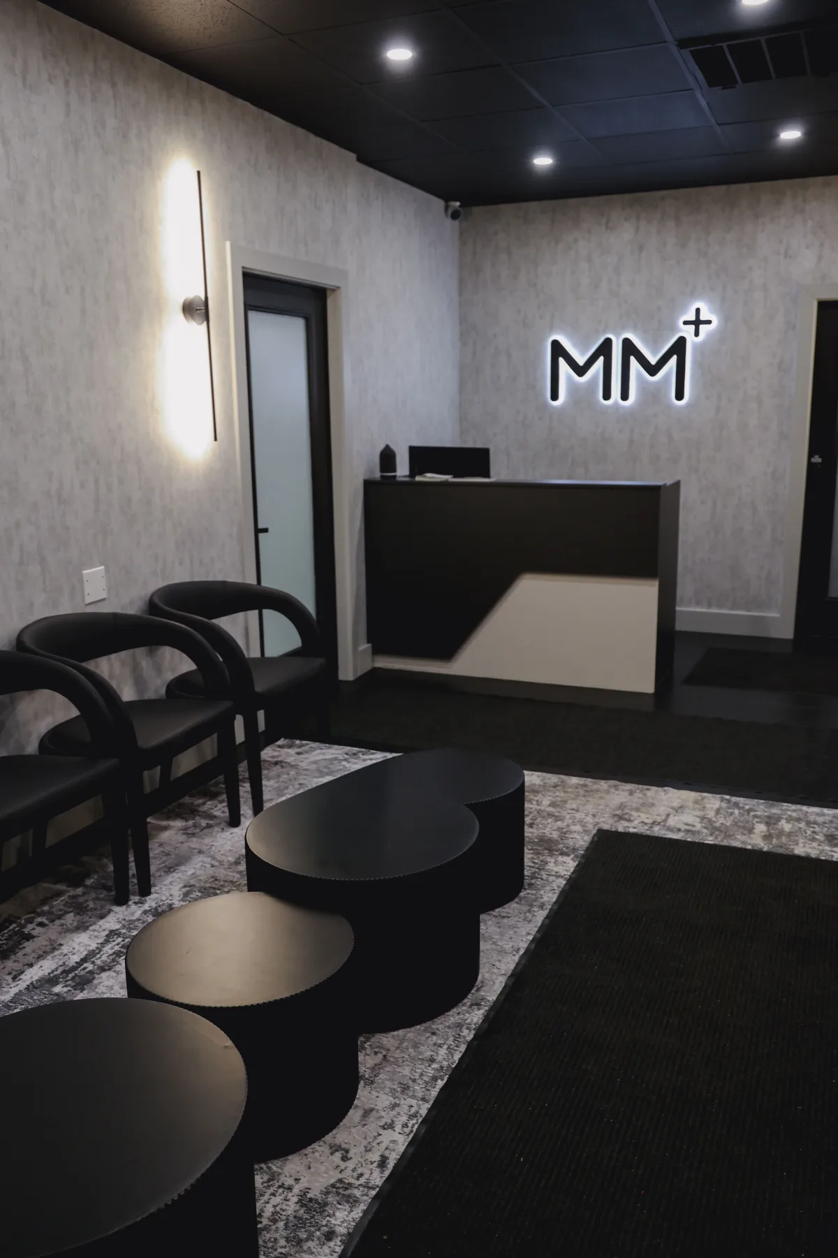 Moonshot Medical waiting area with modern seating and MM+ signage