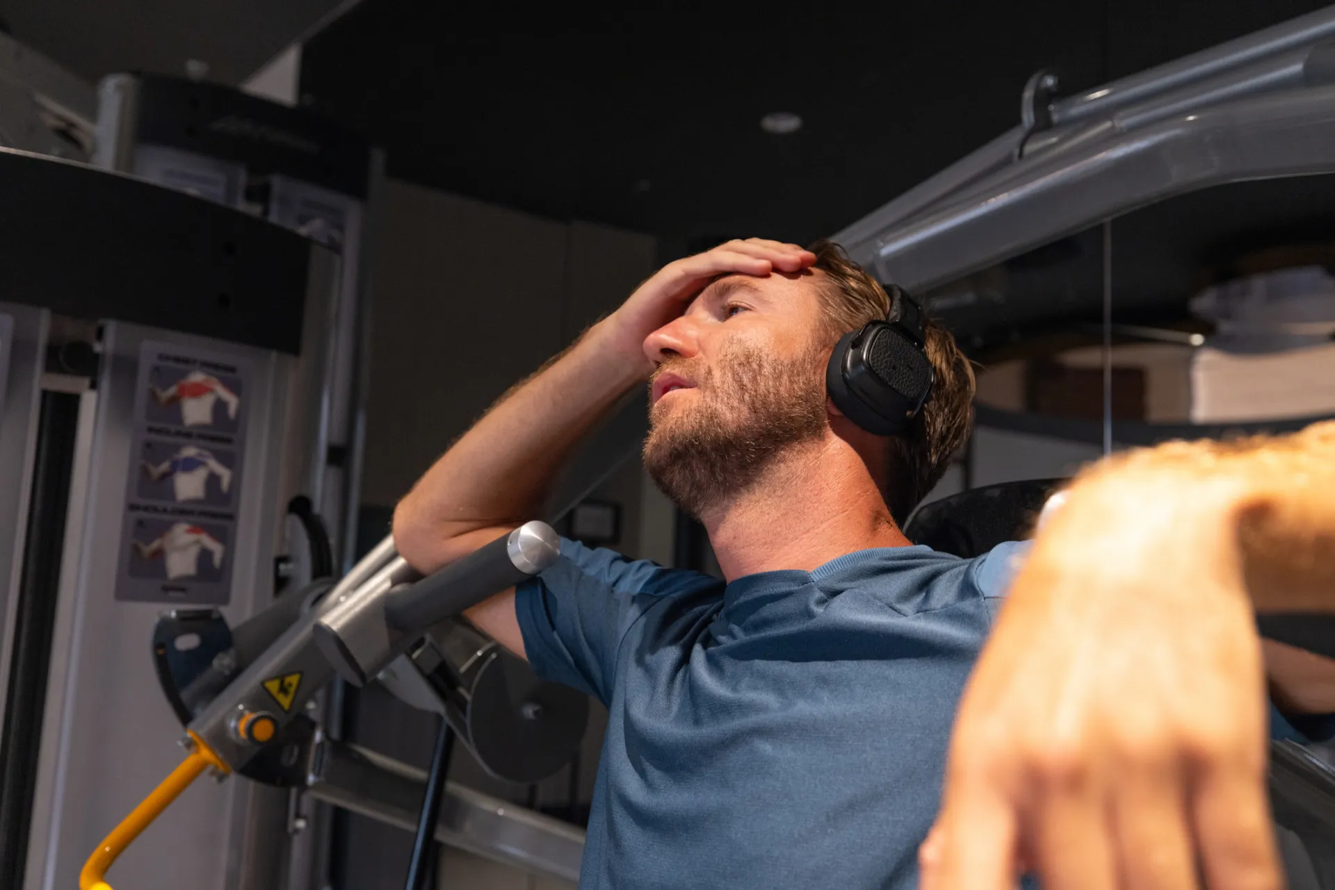 Man fatigued at the gym